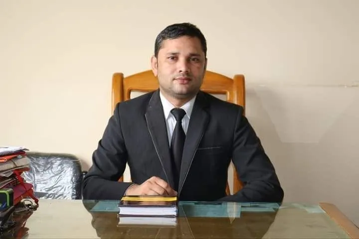 Adv. Azizur Rashid Rasel at his desk